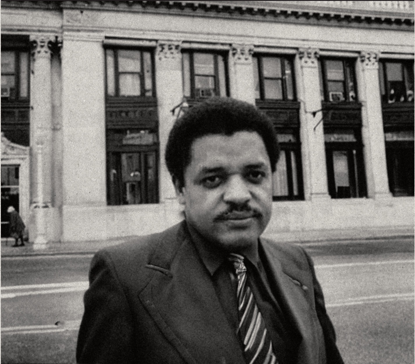 Tom Lewis in front of a bank building