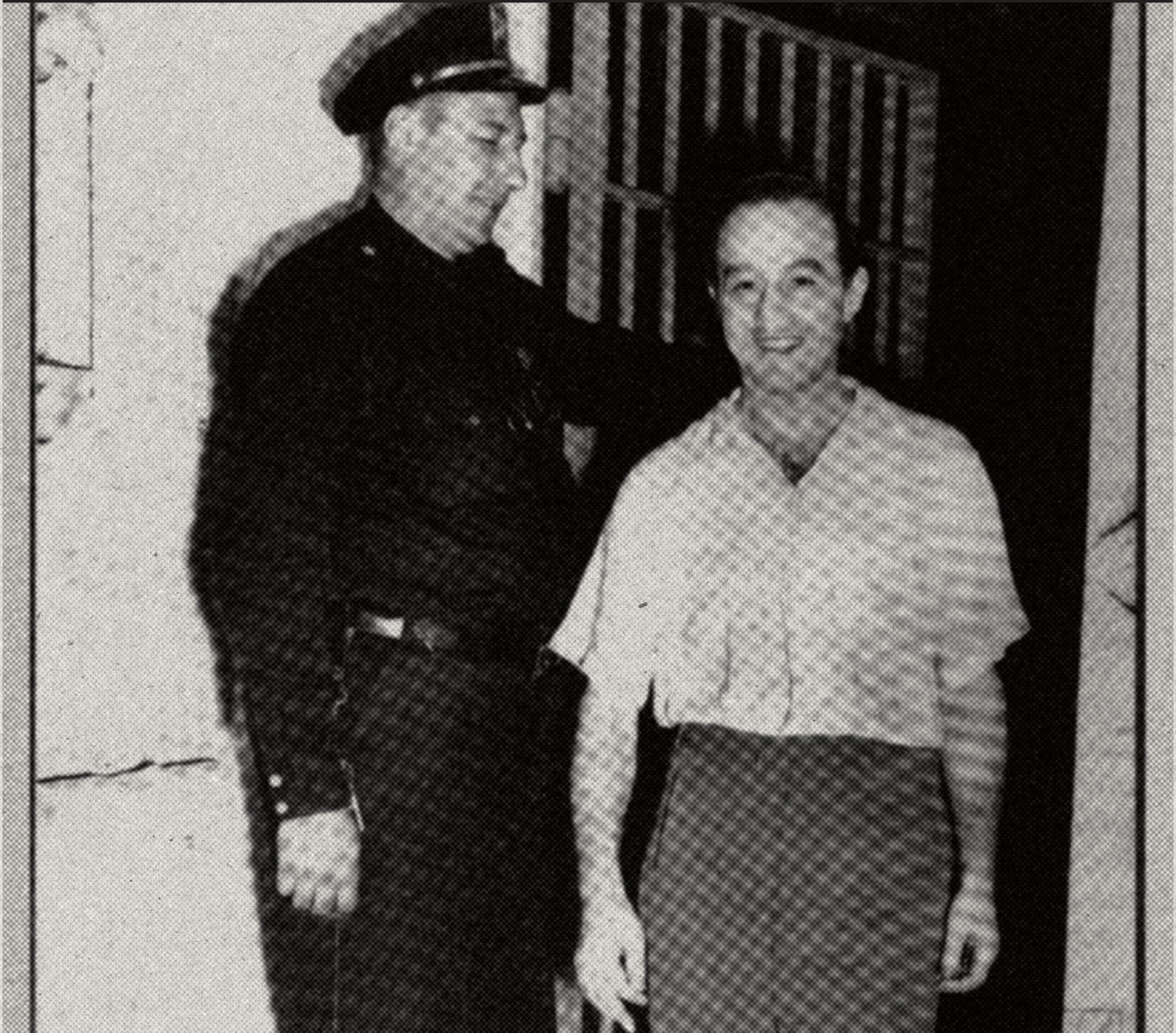 Julius 'Dolly' Weisberg with a police officer
